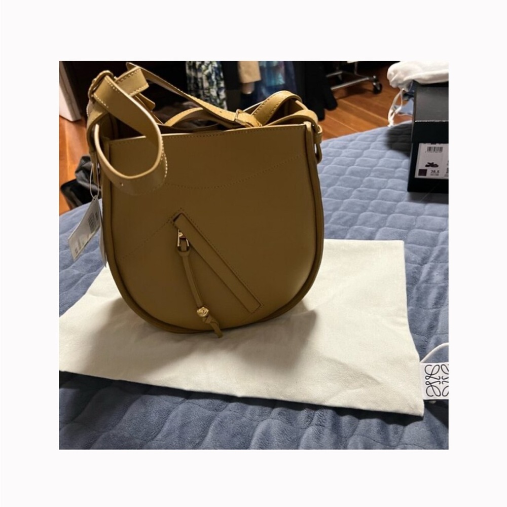 Loewe Hammock Slice bag.Hand carried or worn with a detachable strap.